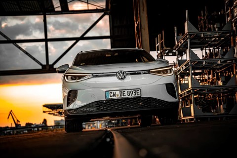 Silver car in an industrial building at dusk, VW ID4 electric car, Deer Carsharing, Calw, Germany