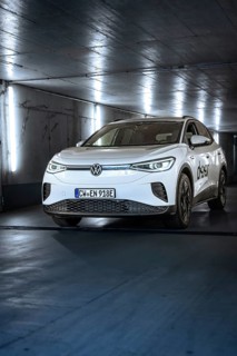 White electric car in an illuminated tunnel with a modern, urban feel, VW ID4 electric car, Deer