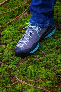 Hiking boots stand on a thick carpet of moss in the forest, Unterhaugstett, Calw district, Germany