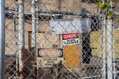 Washington, DC - Signs on a locked gate warn of high voltage and electrical hazards at a Pepco