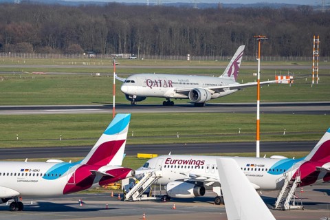 Düsseldorf airport, Qatar Airways Boeing 787 Dreamliner landing, Eurowings aircraft on the apron,
