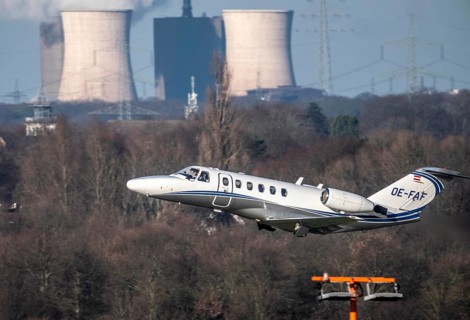 Private aircraft, Austria, OE-FAF Cessna 525A CitationJet CJ2, taking off, in the background the