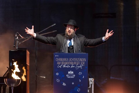 Yehuda Teichtal (Rabbi of the Chabad-Lubavitch movement) speaks at the lighting of lights to mark