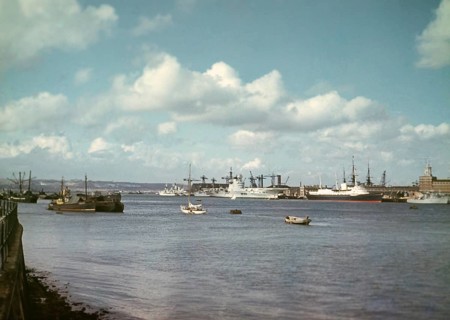 Aircraft carrier HMS Ark Royal (R09) or her sister ship HMS Eagle (R05), with Royal Yacht