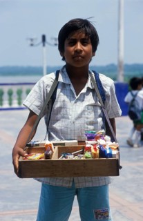 Boy with belly shop selling sweets in Iquitos, Amazon basin, Peru, South America, September 1997,