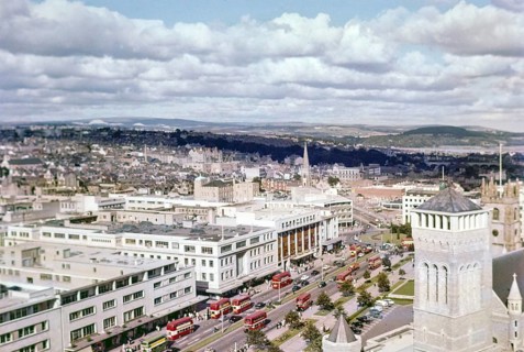 View over Royal Parade city centre street with red double decker buses, Plymouth, Devon, England,