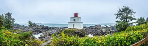 Panoramic view of amphitrite point lighthouse on the rocky ucluelet coast of vancouver island,