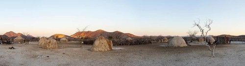 Panorama, Himba huts, traditional Himba village in the savanna, arid landscape, Kaokoveld, Kunene,
