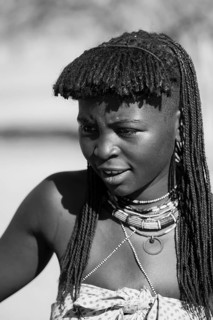 Black and white, portrait, brightly decorated woman of the Hakaona tribe, also Havakona or