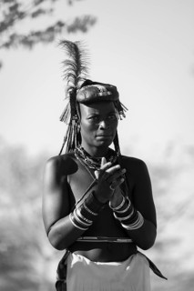 Black and white, traditional dance, brightly decorated woman of the Hakaona tribe also Havakona or