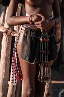 Detail, jewelry and clothing, young Himba woman, traditional Himba village, Kaokoveld, Kunene,