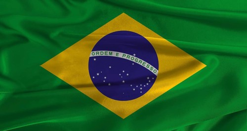 Flag of Brazil with fabric textured background. Close up of National flag of Brazil with realistic