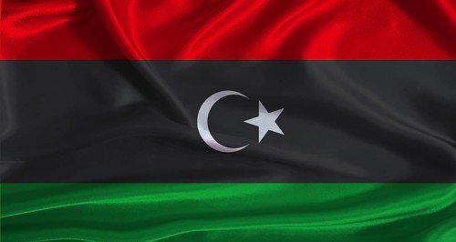 Libya flag with cloth textured background. National flag of Libya with realistic texture