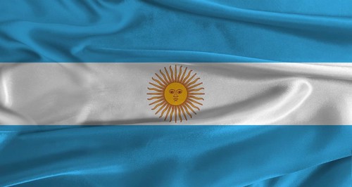 Flag of Argentina with fabric textured background. Close up of National flag of Argentina with