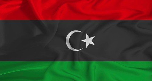 Realistic Libya flag waving. Close up of flag of Libya with cloth texture