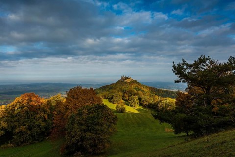 Castle and autumnal forest, Hohenzollern Castle, sunrise, Hechingen, Swabian Jura,