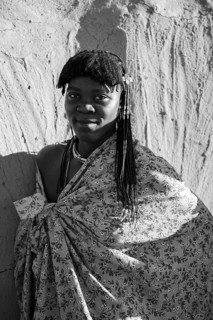 Black and white, portrait, brightly decorated woman of the Hakaona tribe, also Havakona or