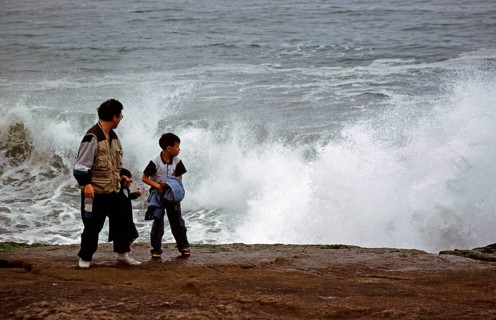 Father and son on the shore, surf, Salto del Fraile, Costa Verde, Lima, Peru, September 1997,