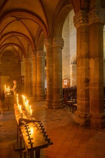 Burning candles in the Collegiata di Santa Maria Assunta, Castell'Arquato, Piacenza Province, Italy