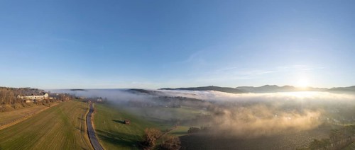 Aerial view of fog and Kremesberg estate, Berndorf, Lower Austria, Austria