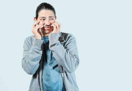 Guy with disgusted face looking to the side isolated. Person with embarrassed face looking to the