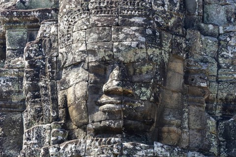 Huge stone-carved faces of Bodhisattva Lokeshvara, also Avalokiteshvara, Bayon Temple, Angkor Thom,