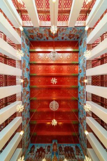Frog's-eye view: Ubosot (ordination hall) with columns (Sao) and richly decorated ceiling (Phra