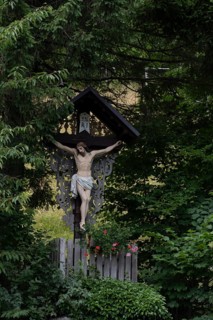 Traditional waycross with figure of Christ, mountaineering village Zgornje Jezersko, Slovenia