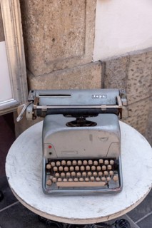 Historic typewriter on a small table, old town of Ljubljana, Slovenia