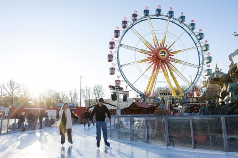 Skaters in front of the Ferris wheel at the Berlin Christmas market on Alexanderplatz, Berlin, 15