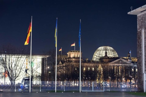 Flags of the Federal Republic of Germany, Ukraine and the European Union in front of the Federal