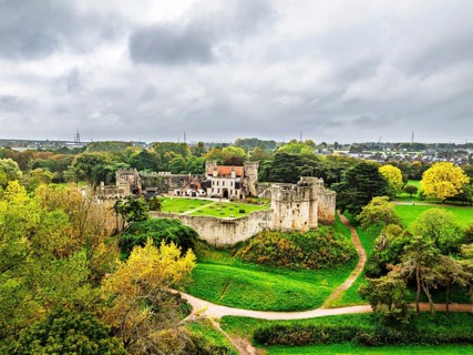 Autumn Colours over ruins of Caldicot Castle from a drone, Caldicot, Monmouthshire, Wales, UK