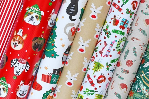 Close up of rolls of different seasonal Christmas wrapping papers
