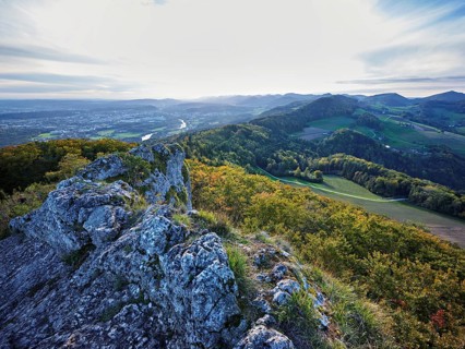 View from the Gisliflue of an autumnal forest with the Jura foothills behind, Talheim, Canton,