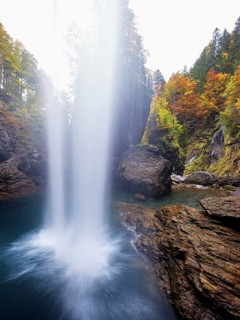Waterfall mountain list in autumn-colored surroundings, Linthal, Klausenpass, Canton of Glarus,
