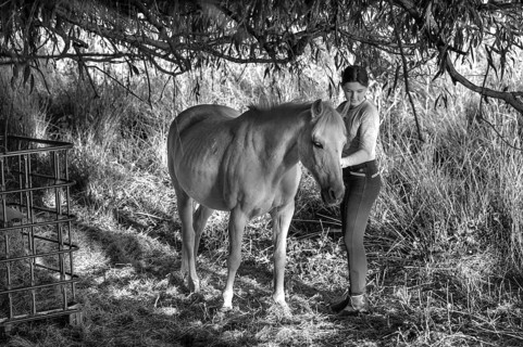 Young girl with her horse in the pasture, black and white, Othenstorf, Mecklenburg-Western