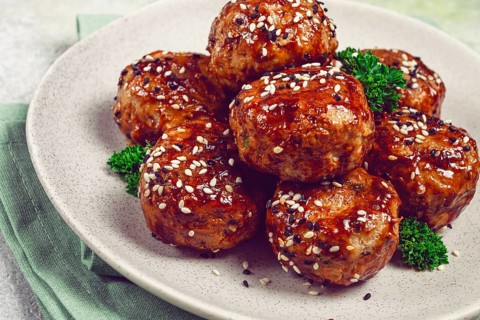 Tsukune, Japanese meatballs, minced chicken, fried on a skewer, with yakitori sauce, homemade, no
