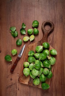 Fresh Brussels sprouts, raw, top view, on a wooden table, no people