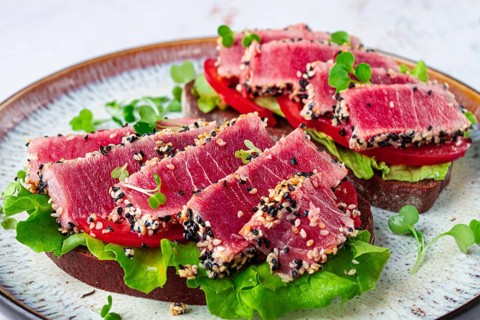 Sandwiches with fried tuna fillet in sesame seeds, breakfast, top view, homemade