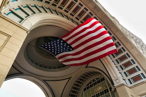 American flag fluttering, distinctive archway, Boston Harbor Hotel, Rowes Wharf, Freedom Trail,