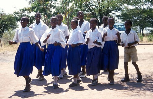 Children from a World Vision project dance on the occasion of a godfather's visit, Nyabubinza,