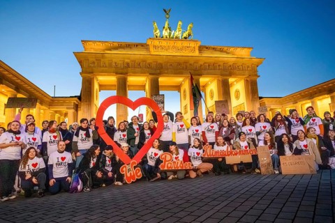 Activists from Fridays For Future pose with I love Paris T-shirts to mark the tenth anniversary of