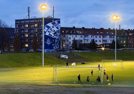 Youth training in the Glückauf Kampfbahn of FC Schalke 04 with wall painting Nordkurve,