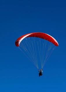 Paragliders against a blue sky, Val d'Anniviers, Valais Alps, Canton of Valais, Switzerland