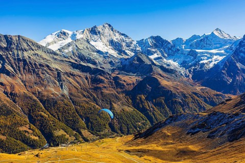 Paragliders flying against the backdrop of the Valais Alps, Val d'Anniviers, Canton of Valais,