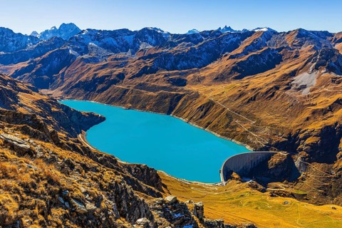 The dam and the turquoise Lac de Moiry reservoir, in the back the Pointe de Moiry mountains, Val