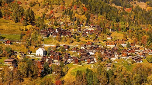 The mountain village of St-Jean in autumn colors, Val d'Anniviers, Valais Alps, Canton of Valais,