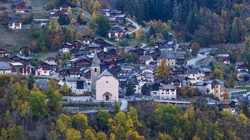 The mountain village of Vissoie with the Sainte Euphemie church at dawn, Val d'Anniviers, Valais