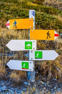 Information boards on trails for hikers and mountaineers near the Lac de Moiry reservoir, Val