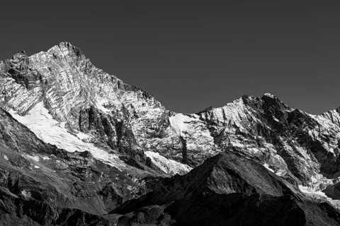 Snowy peaks of the Weisshorn and Schalihorn mountains, black and white photo, Val d'Anniviers,